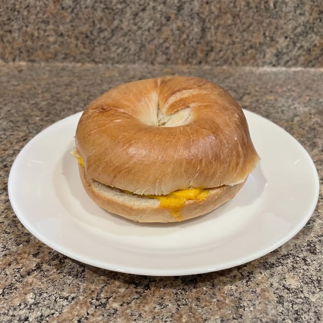 2 Eggs, Meat & Cheese Sandwich with Hash Browns.
